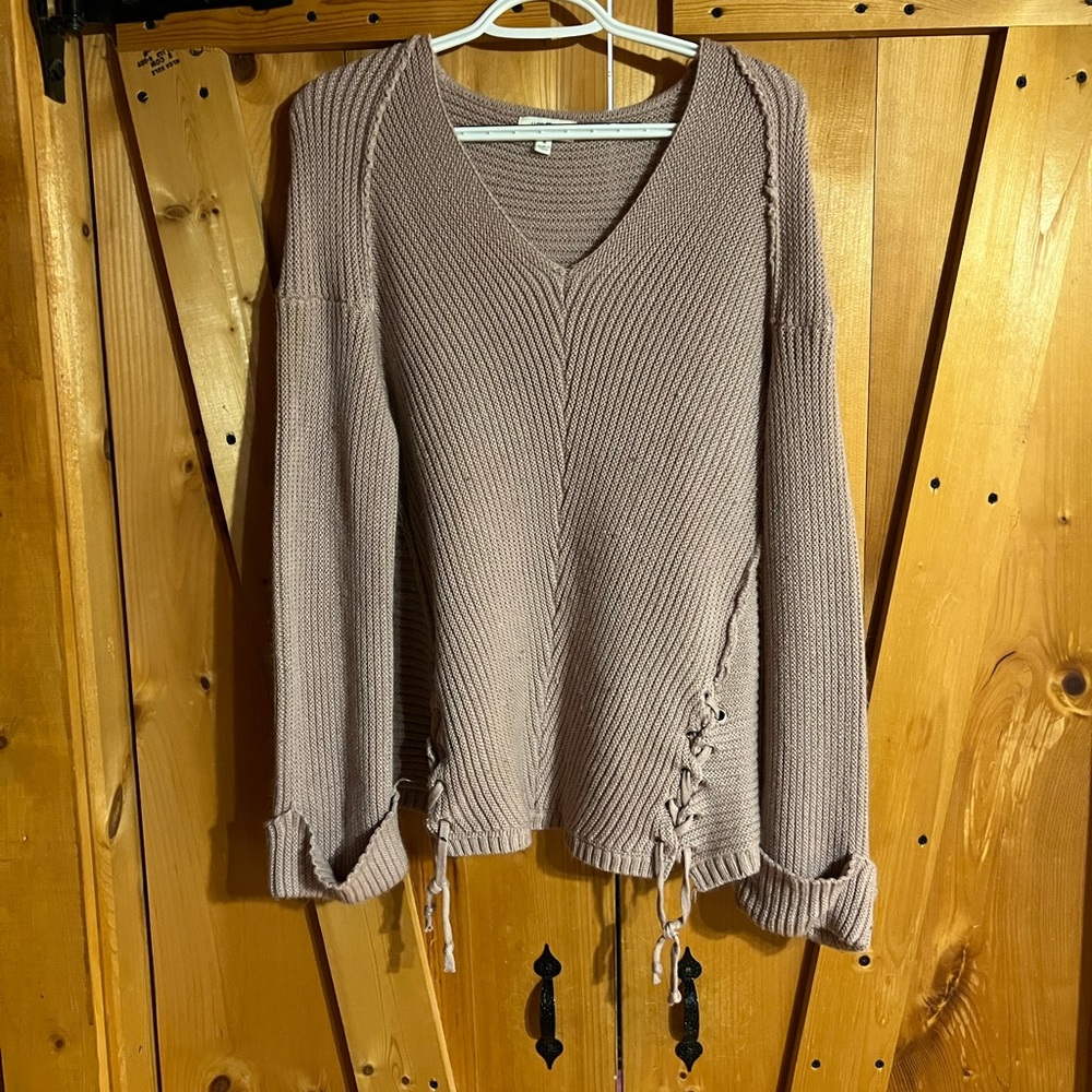 Cream/light pink sweater.